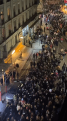 Nighttime protest march fills Paris streets with banners, flags