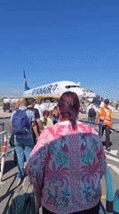 Ryanair flight boards and pushes back from Rome airport
