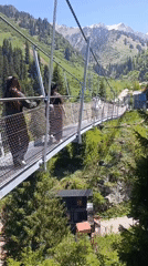 Morning visitors enjoy suspension bridge recreation near Almaty mountains