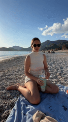 Woman enjoys afternoon beach time in Fethiye, Turkey