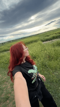 Woman takes selfie in Bulgarian flower field