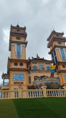 Visitors document ornate Buddhist temples in Vietnam morning tour