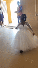 Girl twirls in white dress at Jos church gathering