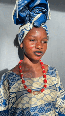 Woman poses in traditional Nigerian dress in Badagry