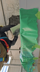 Construction worker repairs concrete walls, ceiling in Ramat Hasharon