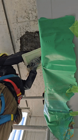 Construction worker repairs concrete walls, ceiling in Ramat Hasharon
