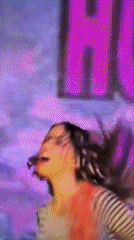 Woman performs with microphone in Enina, Bulgaria