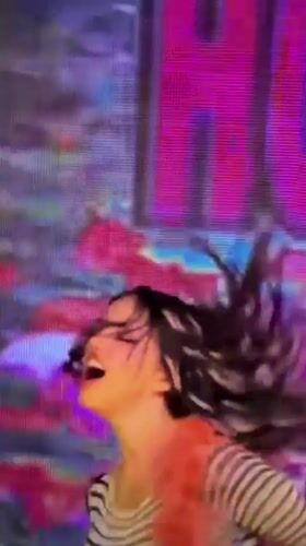 Woman performs with microphone in Enina, Bulgaria