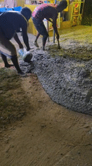 Concrete being poured and spread at a Tamando construction site