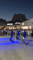 Traditional folk dancing fills Bar's public square at night