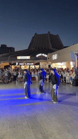 Traditional folk dancing fills Bar's public square at night