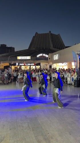 Traditional folk dancing fills Bar's public square at night