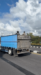 Night road maintenance observed alongside truck in Kuta Selatan