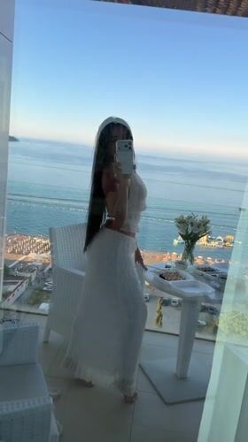 Women document dining and selfies on Montenegro coast balconies