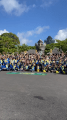 Group in matching shirts photographs at Garuda Wisnu Kencana