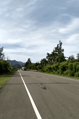 Tropical road documented in Meunasahmesjid under overcast skies