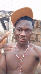 Young man photographed wearing baseball cap in Jos, Nigeria