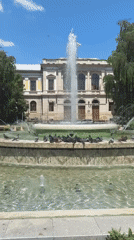 Ruse city center: opera house, ornate facades, and a pigeon fountain