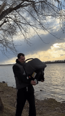 Couple's playful riverbank moment ends with accidental fall