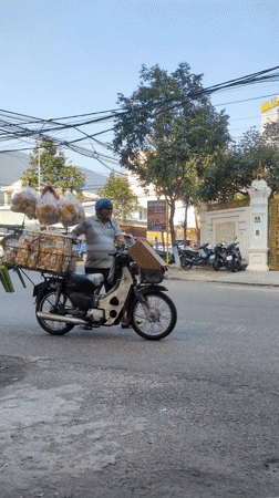 Late night street food vendors and pedestrians in Quy Nhon