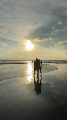 Sunset strolls and footprints captured at Kuta Beach
