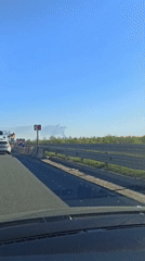 Large smoke plume observed across rural highway corridor