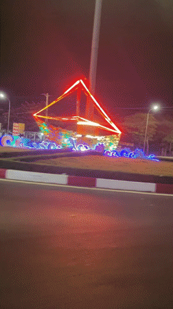 Decorated street lights illuminate nighttime traffic in Vietnamese ward