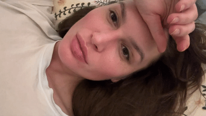 Woman resting indoors captured in Angelovo, Russia