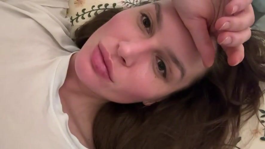 Woman resting indoors captured in Angelovo, Russia