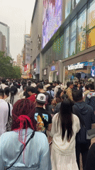 Heavy crowds pack Shanghai commercial district Saturday morning