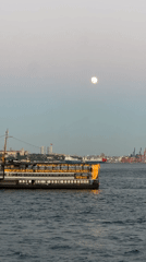 Passenger ship crosses the Bosphorus at twilight