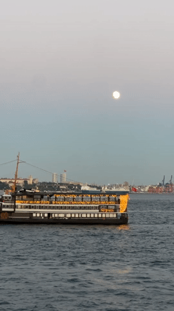 Passenger ship crosses the Bosphorus at twilight