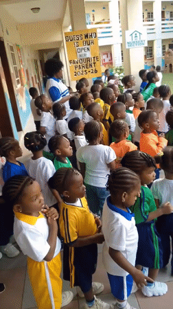 School children gather in uniforms at Idimu courtyard