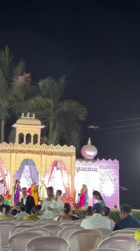 Evening wedding ceremony held outdoors in Shahapur, India