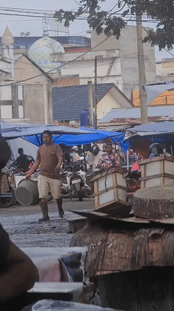 Evening fish market activity documented in Lhokseumawe, Indonesia