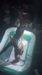 Inflatable pool performance event draws crowds in Milan venue