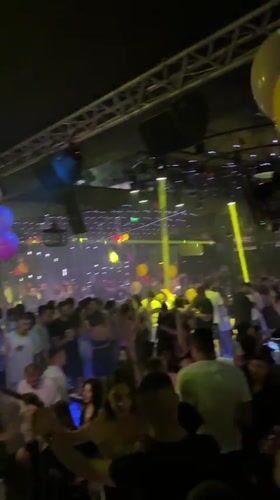 Crowded club night in Varna with live performance and stage lighting