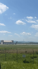 Military aircraft observed at Newburgh airfield through perimeter fence