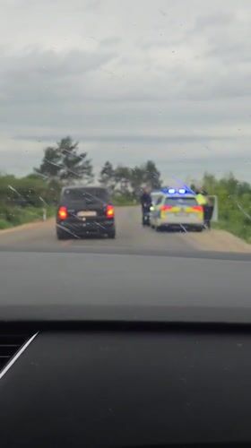 Police pull over black minivan in Aglen, Bulgaria