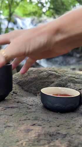 Tea ceremony captured at Selemadeg waterfall, Indonesia
