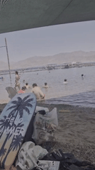 Beachgoers enjoy swimming activities in Eilat waters