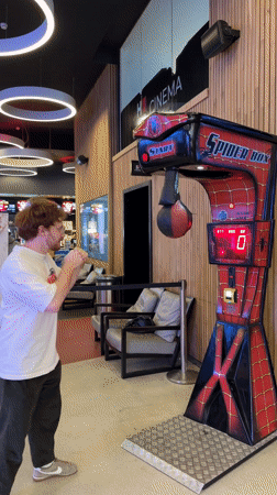 Man plays Spider-Man arcade game at cinema in Rehovot