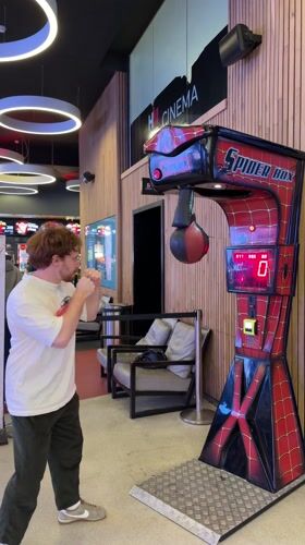 Man plays Spider-Man arcade game at cinema in Rehovot