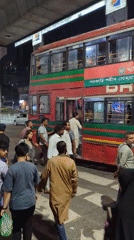 Nighttime bus and rickshaw activity observed in Dhaka