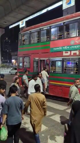 Nighttime bus and rickshaw activity observed in Dhaka