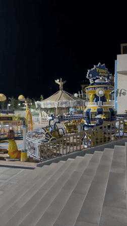 Chinarkent's riverfront park and promenade lit up at night