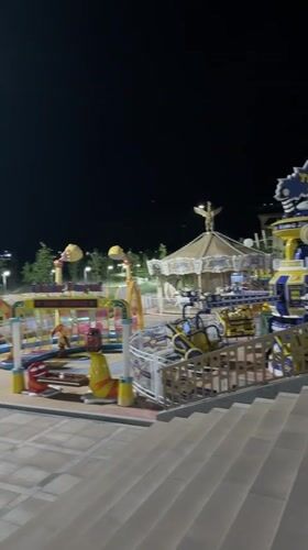 Chinarkent's riverfront park and promenade lit up at night