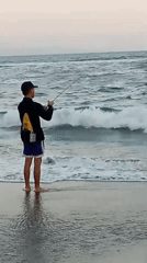 A laid-back beach morning: fishing, kites, swimming, and resort vibes.