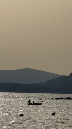 Late afternoon at the Alghero coast, swimming and sun.