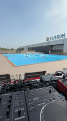 DJ equipment set up poolside at Kazan water park